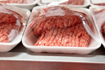 Minced meat in the store close-up. sale of fresh meat in a supermarket