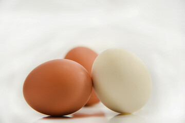 three eggs isolated on white.