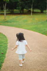 Toddler walking in the park on daylight