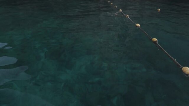 Crystal clear blue and turquoise water with mountains looking at the gorund - maya bay thailand