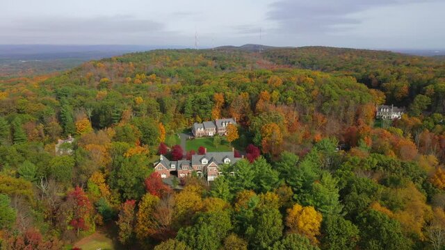 Aerial Dolly Shot of Homes in Beautiful Autumn Landscape