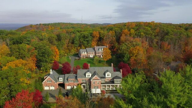 Rise and Reverse Shot of Homes in Beautiful Autumn Landscape