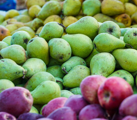 natural pears exposed on the stall to be sold and consumed by customers