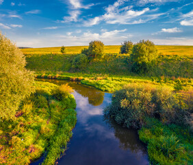 Attractive summer scene of Seret river. Fresh green trees on the shore of river. Wonderful outdoor scene of Ukraine countryside. Beauty of nature concept background.
