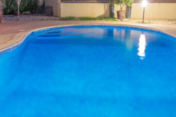 Swimming pool with blue water close up view