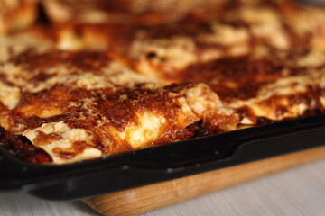 Freshly baked lasagna in baking tray. Making Lasagna Bolognese Series.
