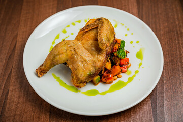 Half of the chicken with vegetable caponata