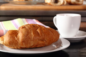 Croissant and coffee cup