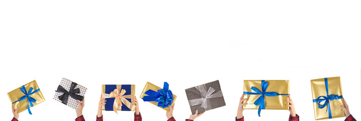 Many different gift boxes in hand with beautiful ribbons isolated on a white background: greeting banner with space for text