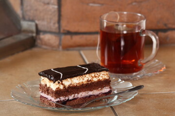 Layer cake with fruit and cream fillings decorated chocolate icing