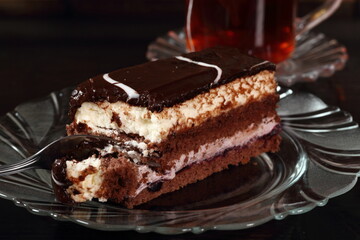 Layer cake with fruit and cream fillings decorated chocolate icing