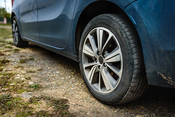 Fototapeta na wymiar Car tire on gravel road.