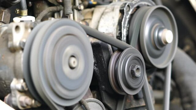 Scene of old car engine running The air conditioning compressor clutch is an electro-magnetic clutch and working when engage the AC system.