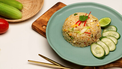 Homemade Thai fried rice on ceramic plate on dinning table, Thai food