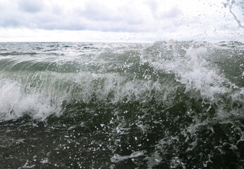 Wave in the sea with splashing water.