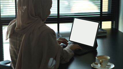 Muslim businesswoman working with digital tablet, include clipping path