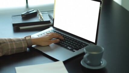 Female hand working with laptop on office desk, include clipping path