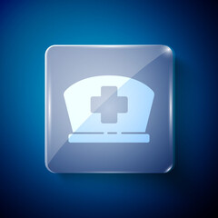 Fototapeta premium White Nurse hat with cross icon isolated on blue background. Medical nurse cap sign. Square glass panels. Vector Illustration.