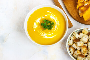 cream pumpkin soup on a light background pumpkin cream soup on a light background with croutons