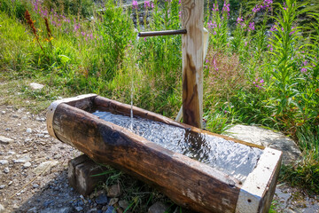 Mountain source fountain in French alps
