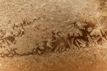 Frosty patterns on window glass in winter