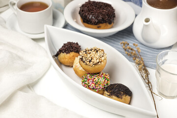 Obraz na płótnie Canvas Mini Baked Donuts with Sweet Sprinkles