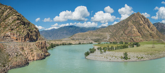 Katun river in the Altai mountains. Scenic panoramic view. Road and village.