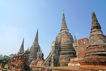 Fototapeta premium Sculpture of Three 3 Ancient old pagoda with the tourist at Wat Phra Si Sanphet is best Famous Landmark old History Buddhist temple in Ayutthaya , Thailand