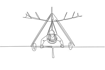 Single continuous line drawing of young tourist man flying with hang gliding parachute on the sky. Extreme vacation holiday sport concept. Trendy one line draw graphic design vector illustration