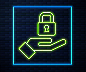 Glowing neon line Lock in hand icon isolated on brick wall background. Padlock sign. Security, safety, protection, privacy concept. Vector.