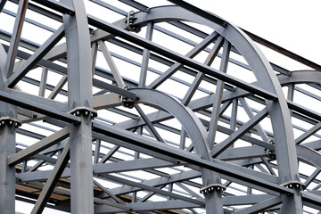 Row of stadium roof metal supports structure. Industrial steel background.