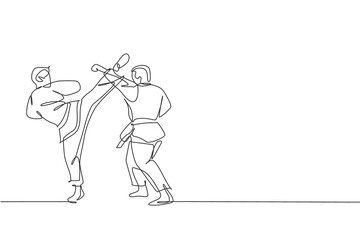 Single continuous line drawing two young confident karateka men in kimono practicing karate combat at dojo. Martial art sport training concept. Trendy one line draw graphic design vector illustration