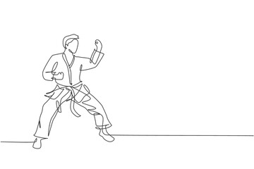 Fototapeta na wymiar One continuous line drawing of young talented karateka man train pose for duel fighting at dojo gym center. Mastering martial art sport concept. Dynamic single line draw design vector illustration
