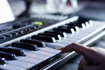 Obraz premium Selective focus of piano or keyboard with human hand