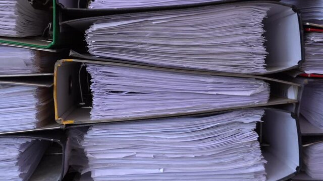 4K closeup video of papers and files in archives of business financial documents