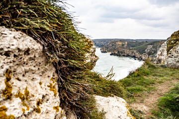 Mountains of steel and stones on the seashore. Wild beach. holidays, privacy,