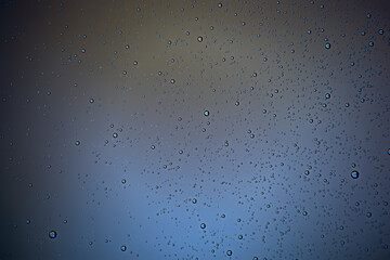 gray wet background / raindrops to overlay on the window, weather, background drops of water rain on the glass transparent