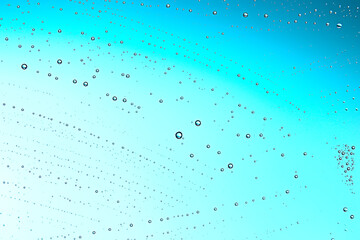 fresh drops background blue glass / wet rainy background, water drops transparent glass blue