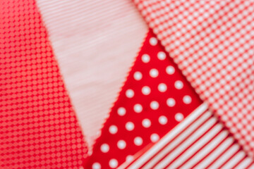 Blurred Background from a natural fabric in a red and white colors. Lay flat