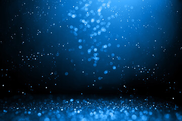 Abstract bokeh on dark blue background. Holiday concept