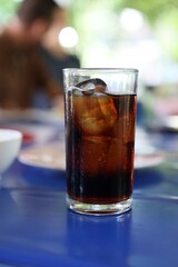 glass of cola with ice