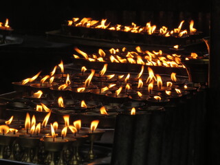worship of indian god godess idol arati with pancha  pradip,burning candles in the temple