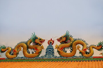 chinese dragon statue on the roof