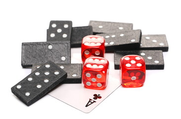 Black dominoes with red die, dice pile and ace poker card isolated on white background