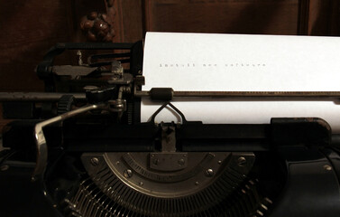 Old typewriter and Install new software words on it, on paper. Concept.