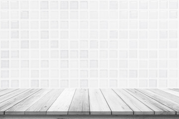 Empty wooden table top on white ceramic tile wall background, Design wood terrace white. Perspective for show space for your copy and branding. Can be used as product display montage. Vintage concept.
