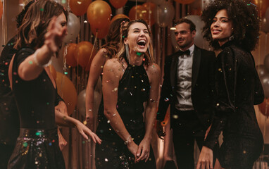 Group of socialites enjoying dancing at new years party