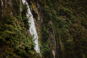 Fototapeta na wymiar Waterfalls and clouds between the mountains