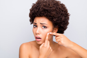 Close-up portrait of her she nice attractive charming worried sad wavy-haired girl touching cheek pimple removing daily wash hygiene isolated on light white gray color pastel background