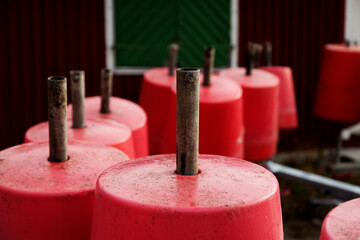 lots of red buoys to a floating bridge